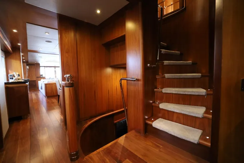 Marin Yacht Photos Pics Luxurious wooden interior of 2014 Sunseeker 131 yacht with elegant staircase and hallway.
