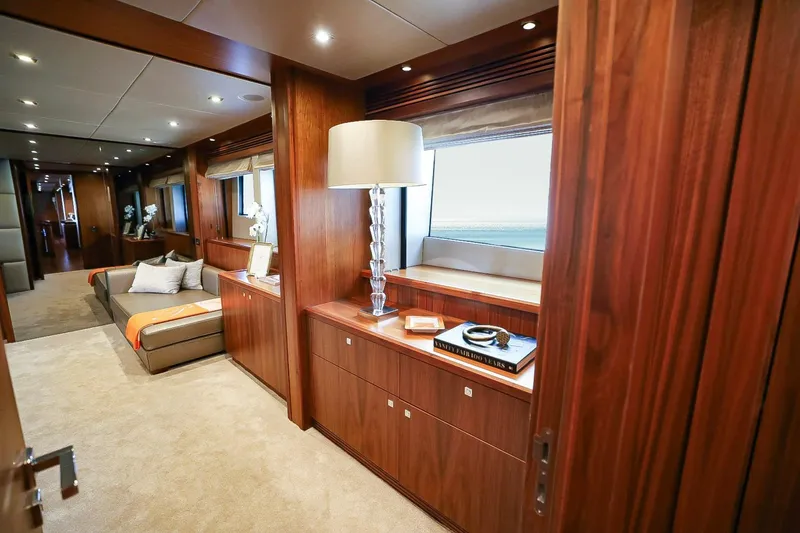 Marin Yacht Photos Pics Luxurious interior of 2014 Sunseeker 131 yacht with elegant wood finishes and modern decor.