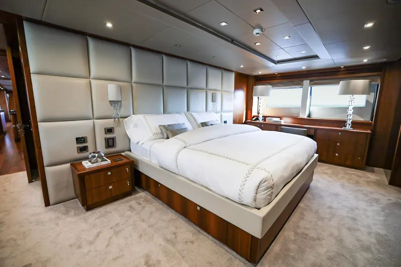 Marin Yacht Photos Pics Luxurious bedroom interior on 2014 Sunseeker 131 yacht, featuring elegant design and plush bedding.