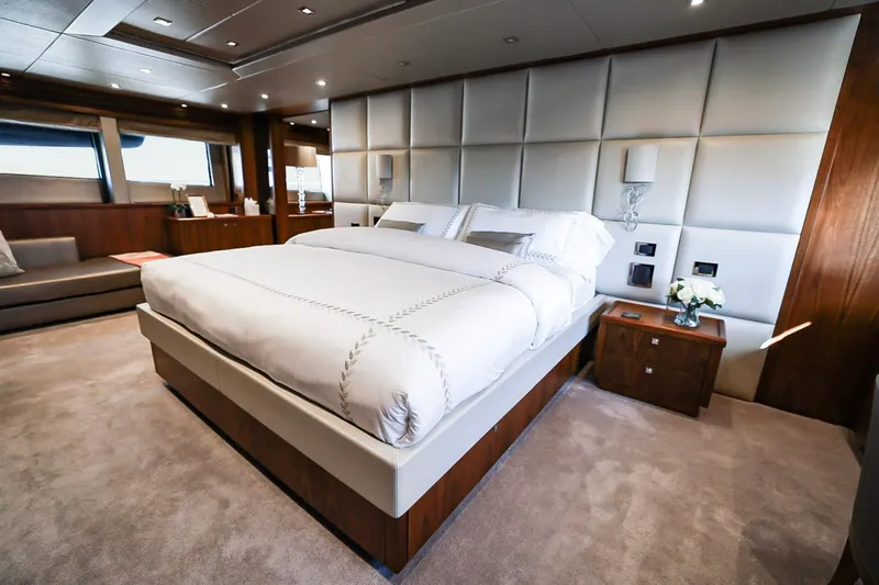 Marin Yacht Photos Pics Luxurious bedroom interior on 2014 Sunseeker 131 yacht, featuring elegant design and plush bedding.