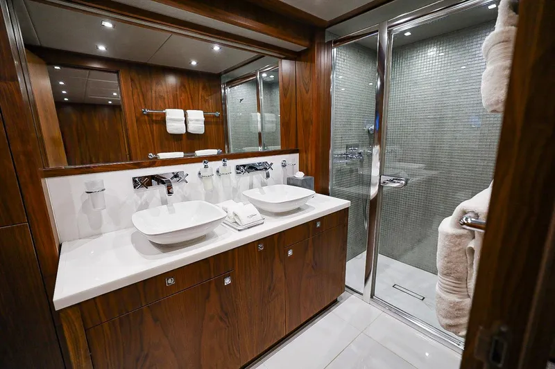 Marin Yacht Photos Pics Luxurious bathroom in 2014 Sunseeker 131 yacht with dual sinks and glass shower.