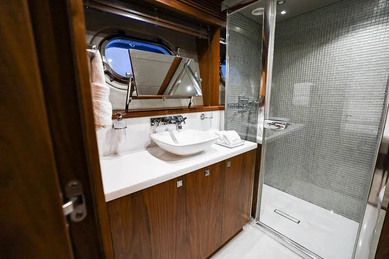 Marin Yacht Photos Pics Luxurious bathroom on 2014 Sunseeker 131 yacht with modern fixtures and elegant design.