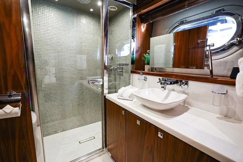 Marin Yacht Photos Pics Luxurious bathroom on 2014 Sunseeker 131 yacht with modern fixtures and elegant design.
