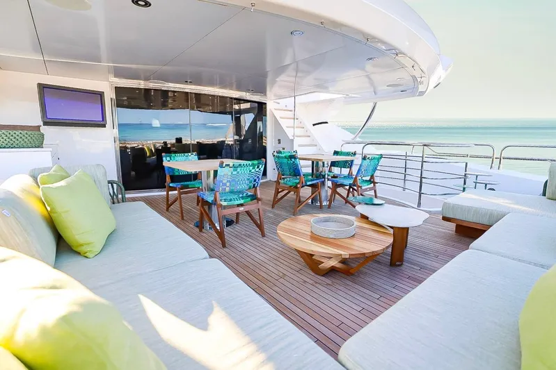 Marin Yacht Photos Pics Luxurious Sunseeker 131 yacht deck with elegant seating, ocean view, and modern decor, 2014 model.