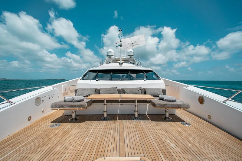 Marin Yacht Photos Pics Luxurious 2014 Sunseeker 131 yacht deck with seating, under a clear blue sky.