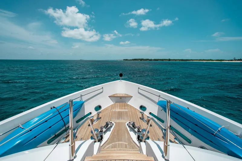 Marin Yacht Photos Pics Bow view of 2014 Sunseeker 131 yacht cruising on open sea under clear skies.