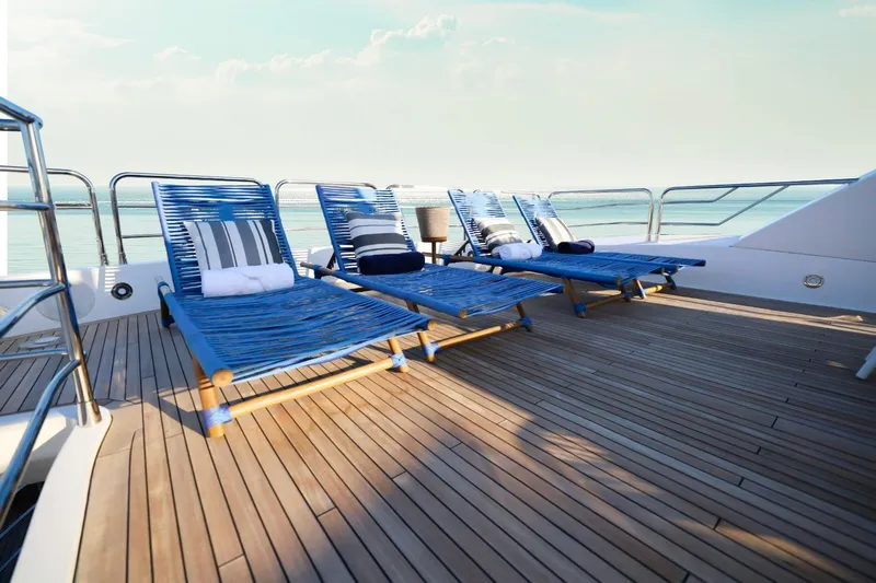Marin Yacht Photos Pics Sunseeker 131 yacht deck with blue loungers, ocean view, 2014 model.