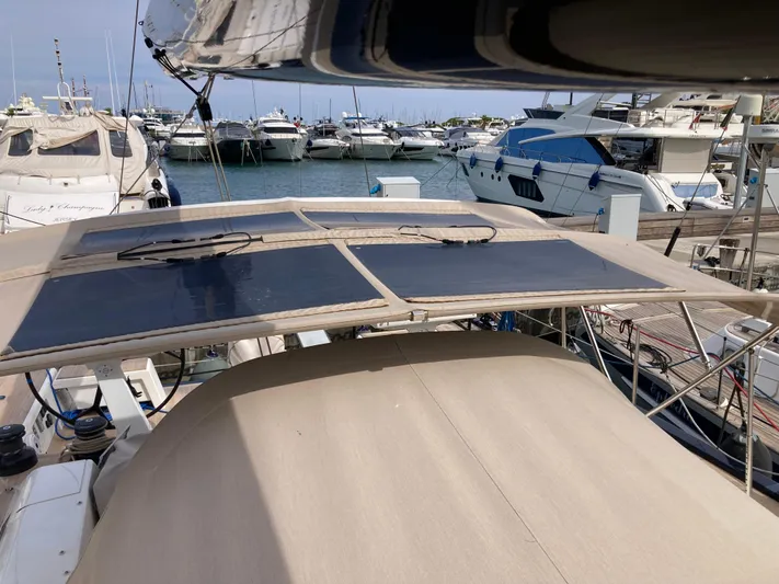  Yacht Photos Pics Solaris 55 yacht with solar panels docked at a marina, 2022 model.