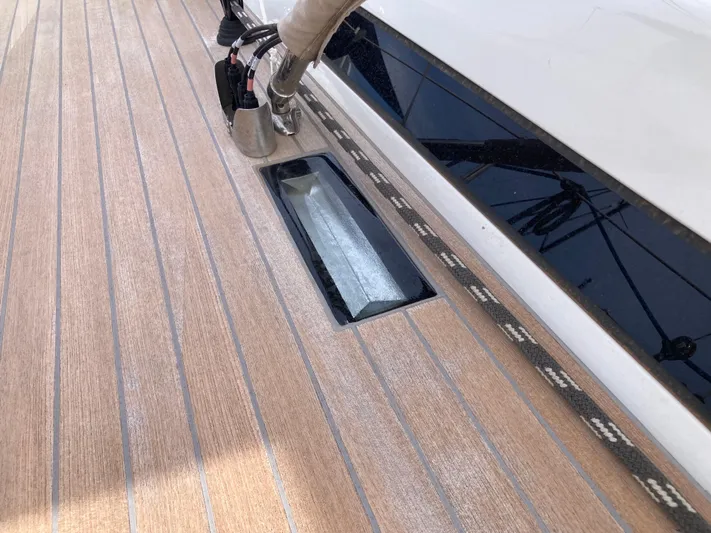  Yacht Photos Pics Teak deck of 2022 Solaris 55 yacht with sleek design elements.