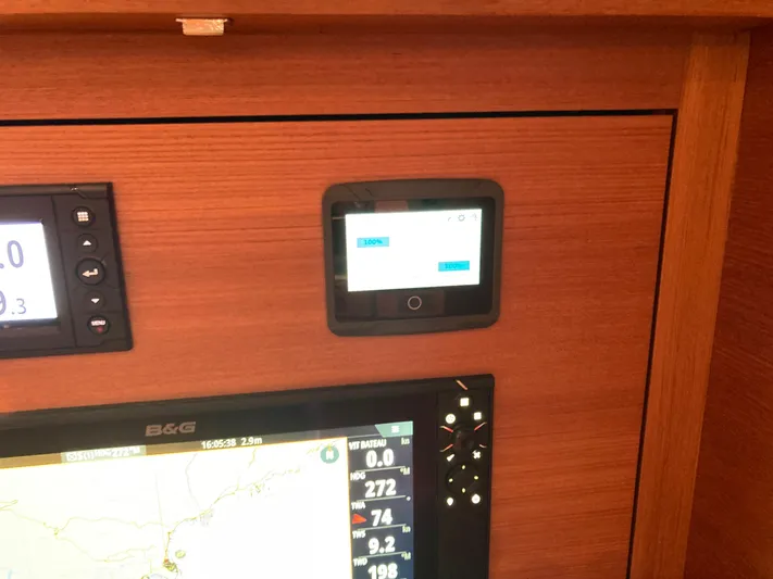  Yacht Photos Pics Control panel of a 2022 Solaris 55 yacht with navigation and battery displays.