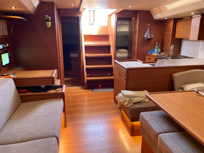  Yacht Photos Pics Luxurious interior of a 2022 Solaris 55 yacht with wooden furnishings and modern amenities.