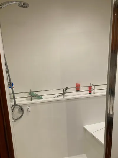  Yacht Photos Pics Modern shower area in a 2022 Solaris 55 yacht bathroom.