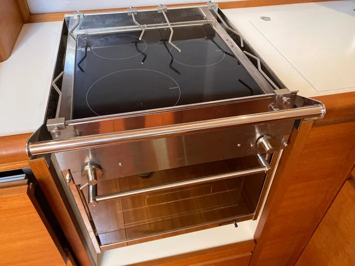  Yacht Photos Pics Modern kitchen stove on Solaris 55 yacht, 2022 model, with sleek design and induction cooktop.