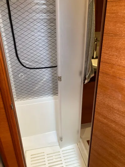  Yacht Photos Pics Shower area in 2022 Solaris 55 yacht with frosted door and modern design.