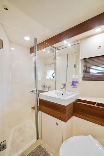  Yacht Photos Pics Luxurious bathroom in 2013 Sea Ray 410 Sundancer yacht with modern fixtures and elegant design.