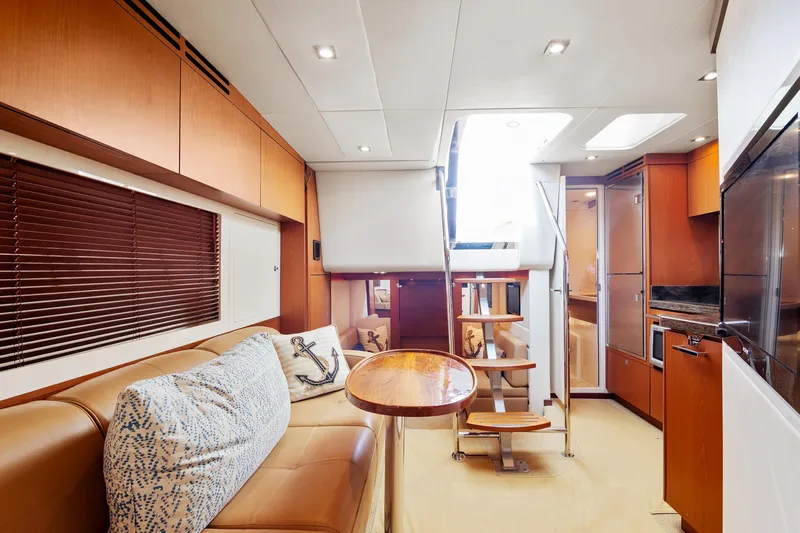  Yacht Photos Pics Interior of 2013 Sea Ray 410 Sundancer yacht with modern furnishings and wooden accents.