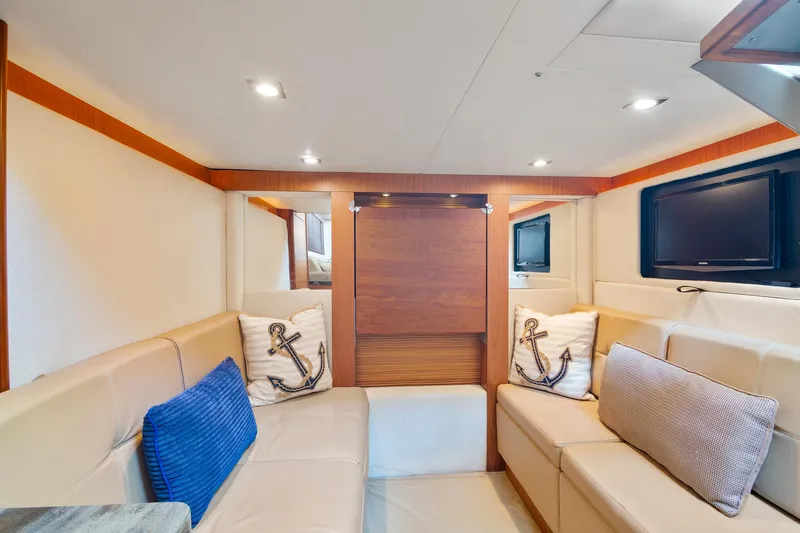  Yacht Photos Pics Luxurious interior of 2013 Sea Ray 410 Sundancer yacht with cozy seating and nautical decor.