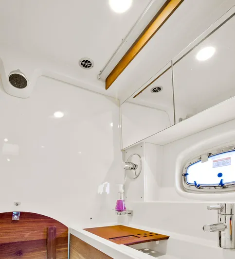  Yacht Photos Pics Luxurious bathroom interior of 2013 Sea Ray 410 Sundancer yacht with modern fixtures.