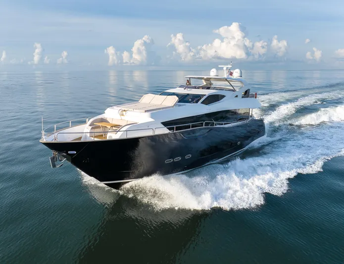 Eos Yacht Photos Pics 2021 Sunseeker 95 Yacht cruising on calm ocean waters.