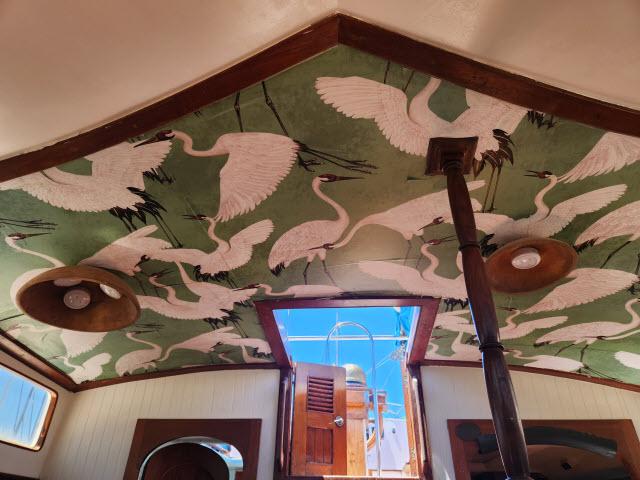 Interior ceiling of 1978 Hardin Voyager 44 with bird-themed artwork.
