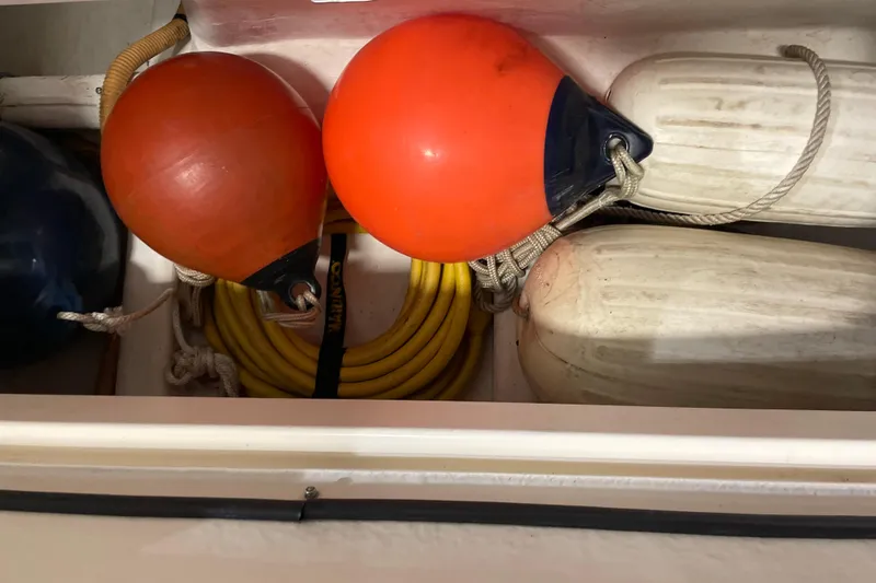  Yacht Photos Pics Storage compartment with buoys and rope on a 2002 Riviera 34 Convertible boat.