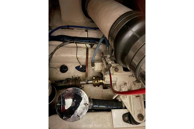  Yacht Photos Pics Engine compartment of 2002 Riviera 34 Convertible boat, showing mechanical components and wiring.