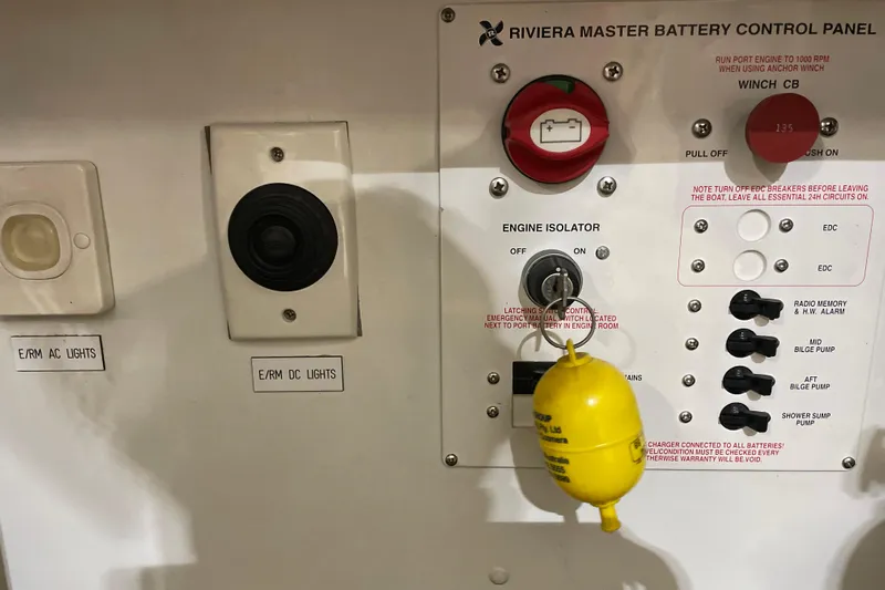  Yacht Photos Pics Control panel of a 2002 Riviera 34 Convertible boat with switches and labels.
