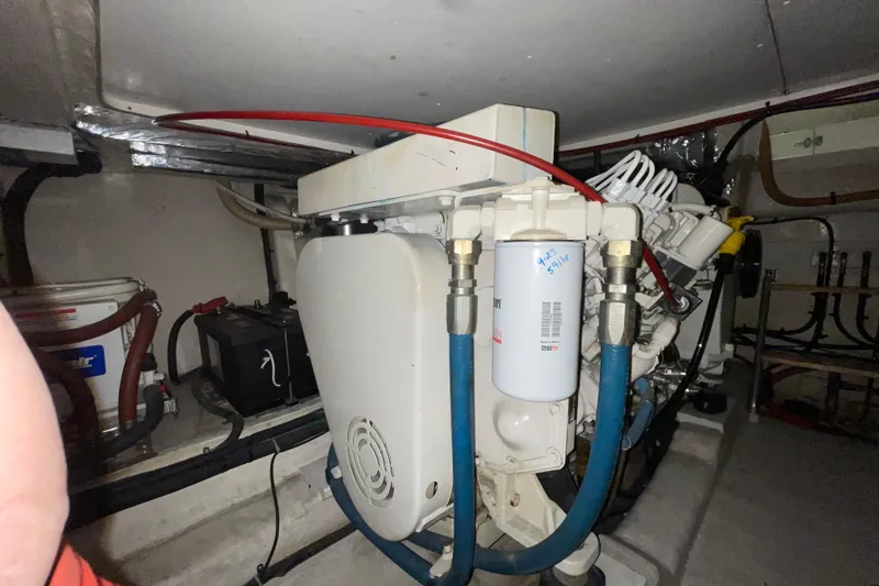  Yacht Photos Pics Engine room of 2002 Riviera 34 Convertible with visible machinery and components.