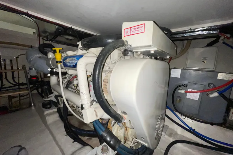  Yacht Photos Pics Engine room of a 2002 Riviera 34 Convertible boat, showcasing mechanical components.