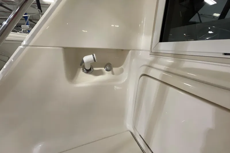  Yacht Photos Pics 2002 Riviera 34 Convertible boat interior detail with faucet and window.