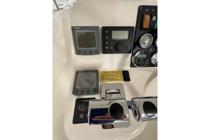  Yacht Photos Pics Control panel of 2002 Riviera 34 Convertible boat with gauges and switches.