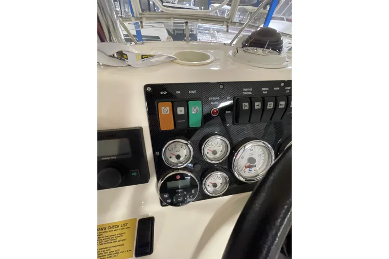  Yacht Photos Pics Control panel of a 2002 Riviera 34 Convertible boat with gauges and switches.