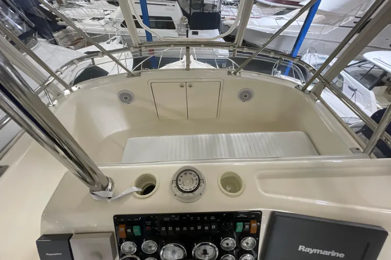  Yacht Photos Pics Cockpit view of 2002 Riviera 34 Convertible yacht with navigation controls.