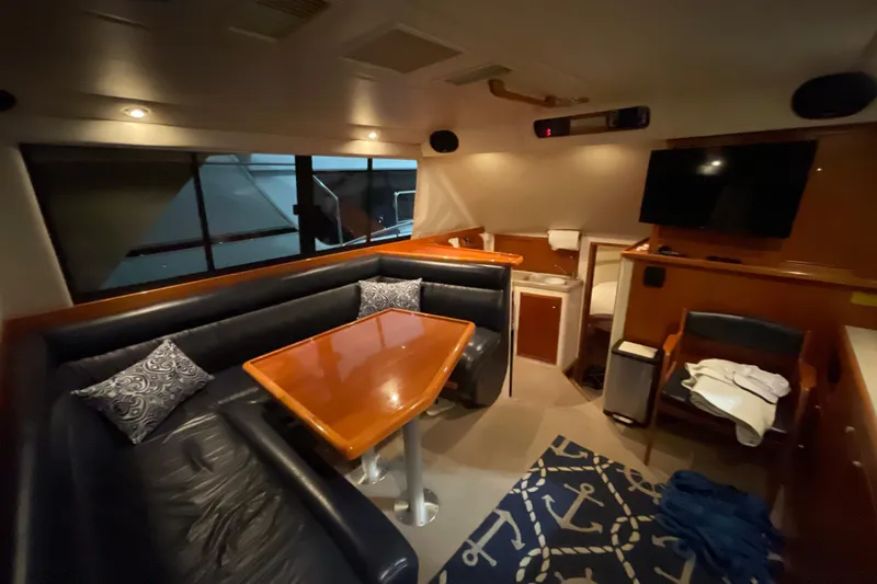  Yacht Photos Pics Interior of 2002 Riviera 34 Convertible yacht with cozy seating and modern amenities.