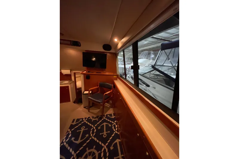  Yacht Photos Pics Interior of 2002 Riviera 34 Convertible yacht with nautical decor and marina view.