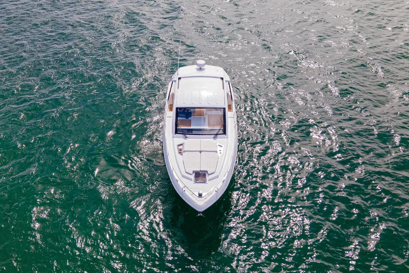  Yacht Photos Pics 2018 Cruisers Yachts 390 Express Coupe on open water, aerial view.