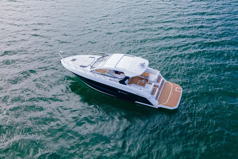 Yacht Photos Pics 2018 Cruisers Yachts 390 Express Coupe on open water, aerial view.