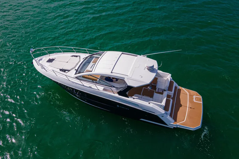  Yacht Photos Pics 2018 Cruisers Yachts 390 Express Coupe on open water, aerial view.