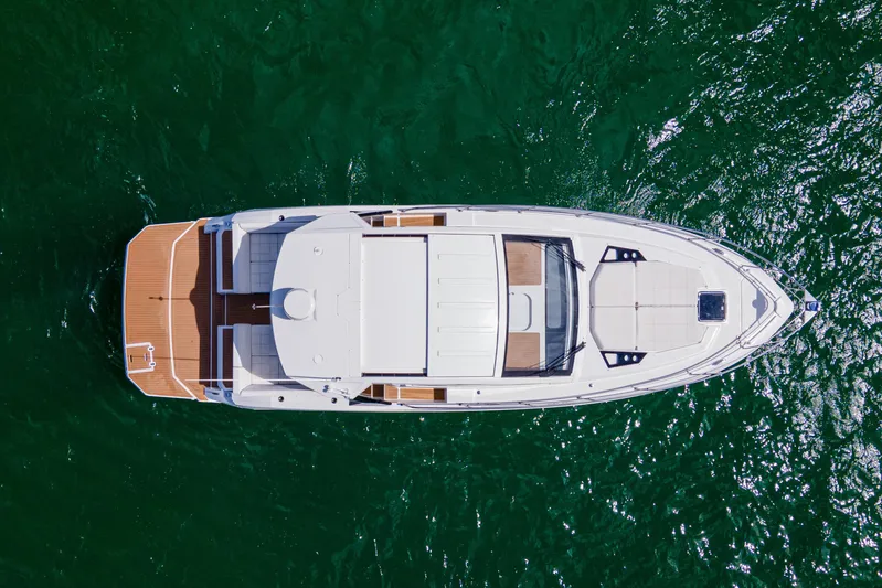  Yacht Photos Pics Aerial view of 2018 Cruisers Yachts 390 Express Coupe on green water.