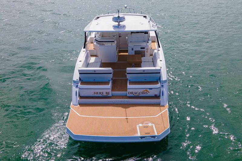  Yacht Photos Pics 2018 Cruisers Yachts 390 Express Coupe on water, rear view, spacious deck.