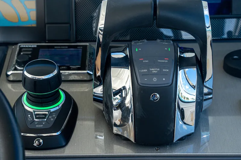  Yacht Photos Pics Control panel of 2018 Cruisers Yachts 390 Express Coupe with joystick and throttle controls.