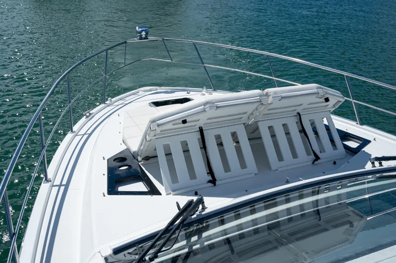  Yacht Photos Pics 2018 Cruisers Yachts 390 Express Coupe with sun loungers on deck, cruising on water.