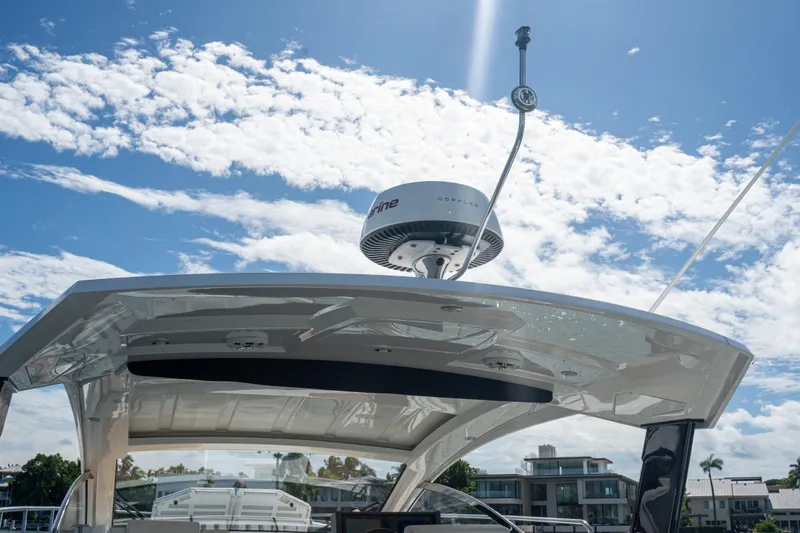  Yacht Photos Pics 2018 Cruisers Yachts 390 Express Coupe radar system under a clear blue sky.