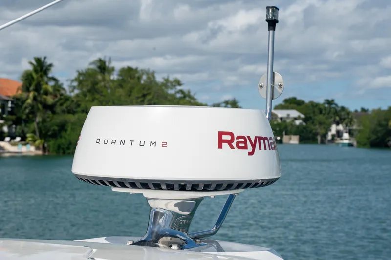  Yacht Photos Pics Raymarine Quantum 2 radar on 2018 Cruisers Yachts 390 Express Coupe, scenic waterfront background.