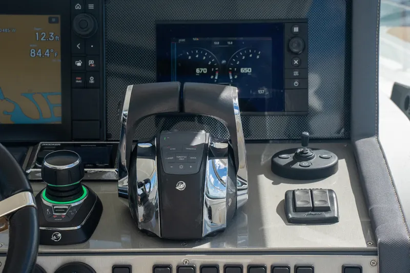  Yacht Photos Pics Control panel of 2018 Cruisers Yachts 390 Express Coupe with modern navigation displays.