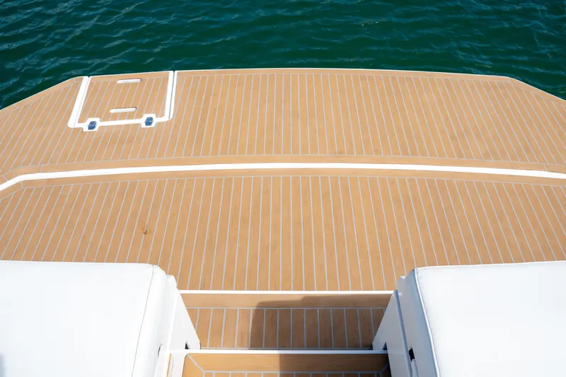  Yacht Photos Pics 2018 Cruisers Yachts 390 Express Coupe swim platform with teak decking, overlooking blue water.
