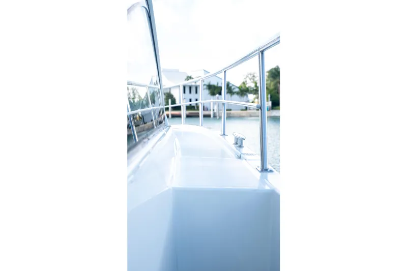 Yacht Photos Pics 2018 Cruisers Yachts 390 Express Coupe deck view with railing and water backdrop.