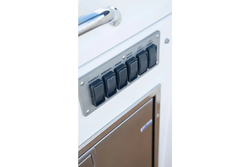  Yacht Photos Pics Control panel on 2018 Cruisers Yachts 390 Express Coupe, featuring labeled switches.