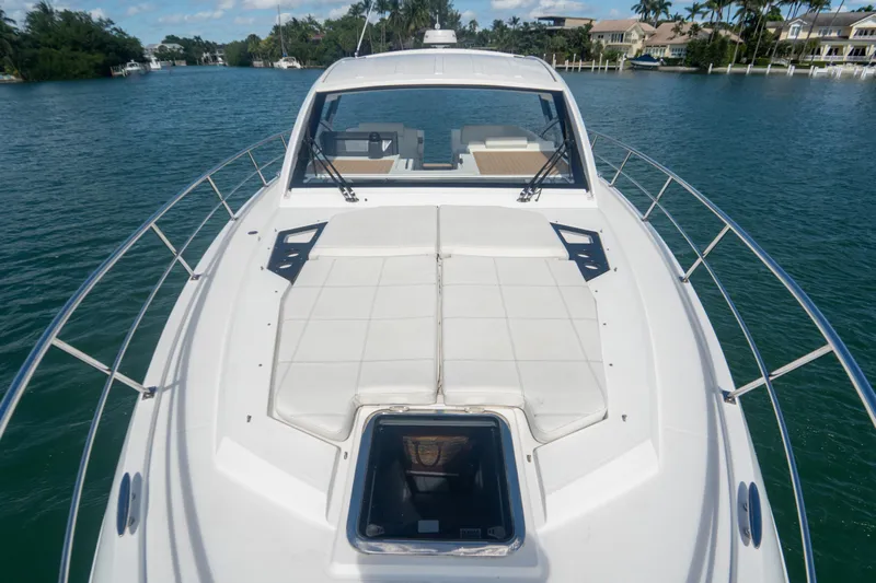  Yacht Photos Pics 2018 Cruisers Yachts 390 Express Coupe on serene water, showcasing sleek design and spacious deck.