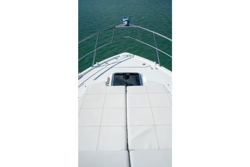  Yacht Photos Pics 2018 Cruisers Yachts 390 Express Coupe bow view with sunpad and railing.